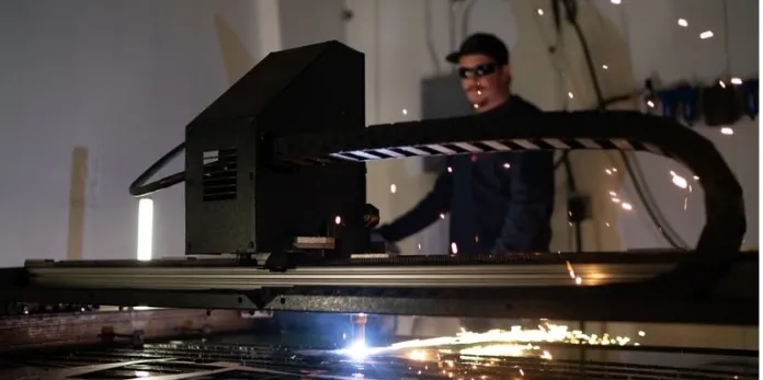 Innovations Manufacturing CNC plasma cutting process with sparks